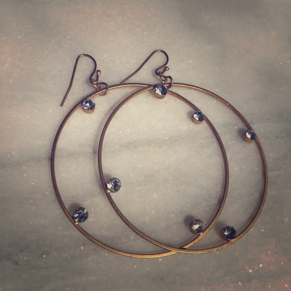 Hoop and diamond gold fashion earrings.